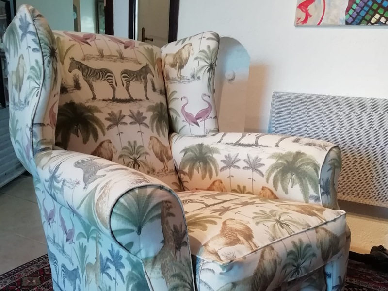 armchair recovered in animal fabric