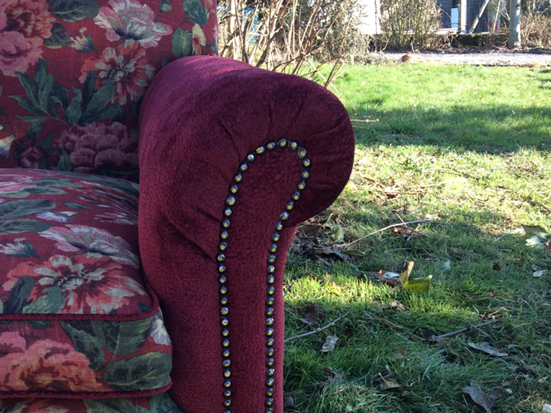metal studding on newly recovered armchair