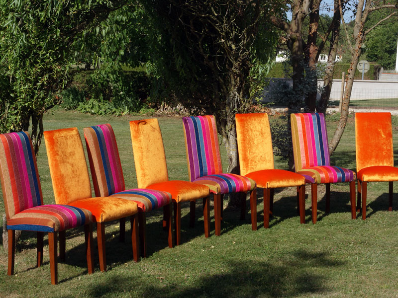 a set of striped dining chairs just upholstered
