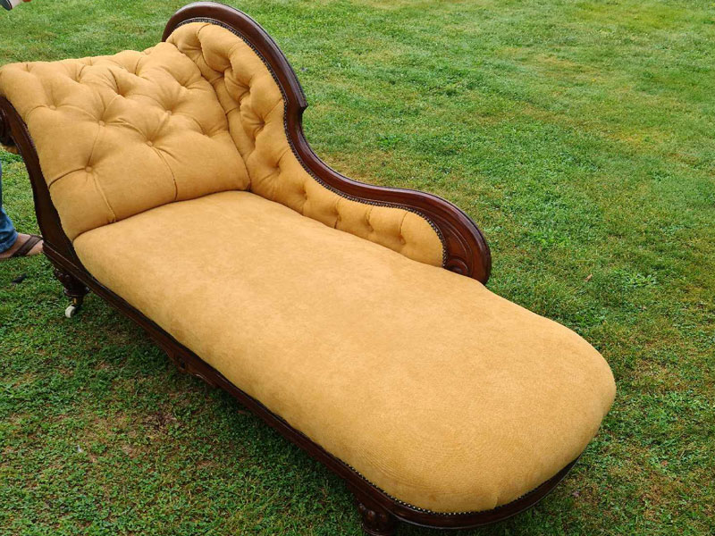 chaise longue recovered in gold colored fabric